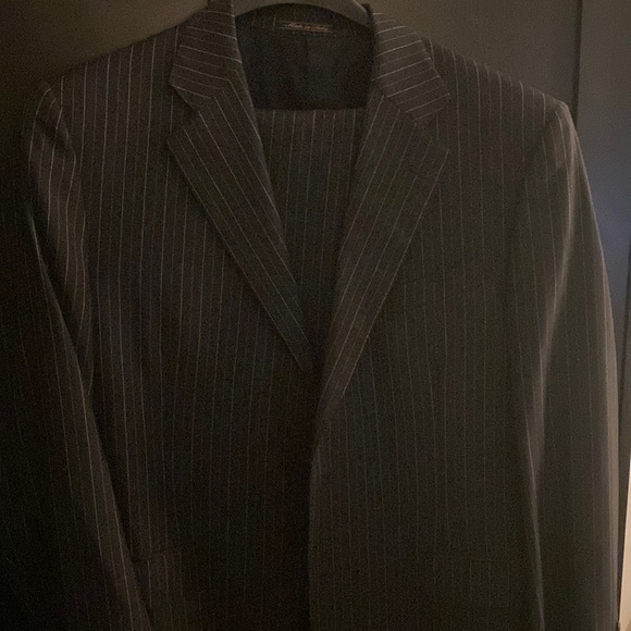 Charcoal double striped suit. Two button single breast notch lapel.